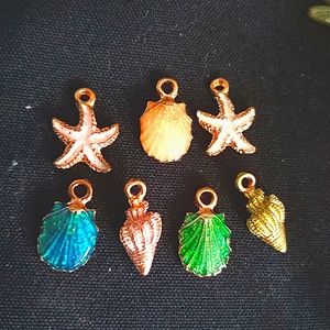 Group of 7 gold tone sea life charms